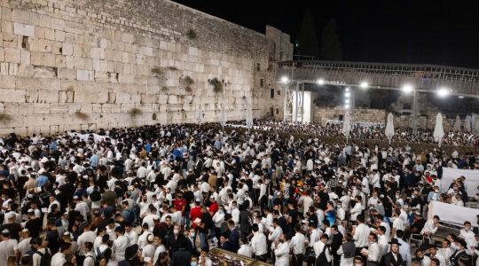 Jews pray for forgivness, or selichot, at the Western Wall in the Old City of Jerusalem on September 5, 2021 (Yonatan Sindel/Flash90)