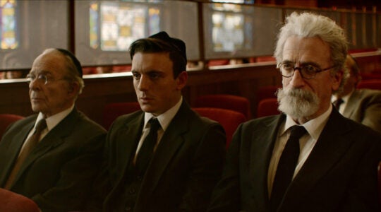 Three men in a synagogue in the movie "Minyan"