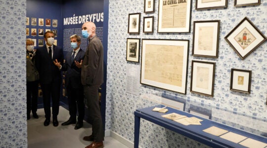 French President Emmanuel Macron, third from right, visits the Dreyfus Museumin Medan near Paris, on Oct. 26, 2021. (Ludovic Marin/AFP via Getty Images)