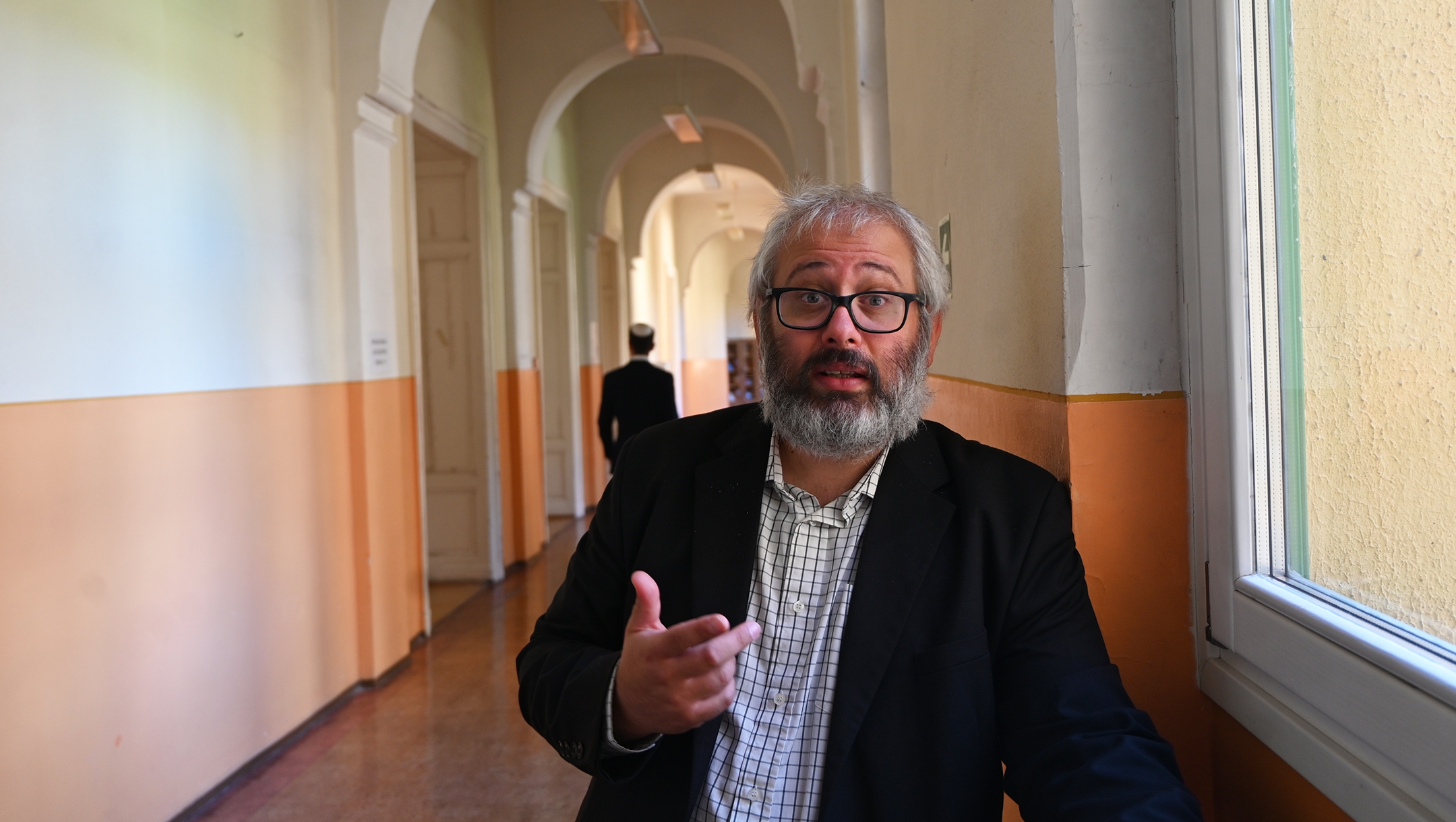 Rabbi Gabor Finali speaks to a journalist at the The Budapest University of Jewish Studies in Budapest, Hungary on Aug. 29, 2021. (Cnaan Liphshiz)