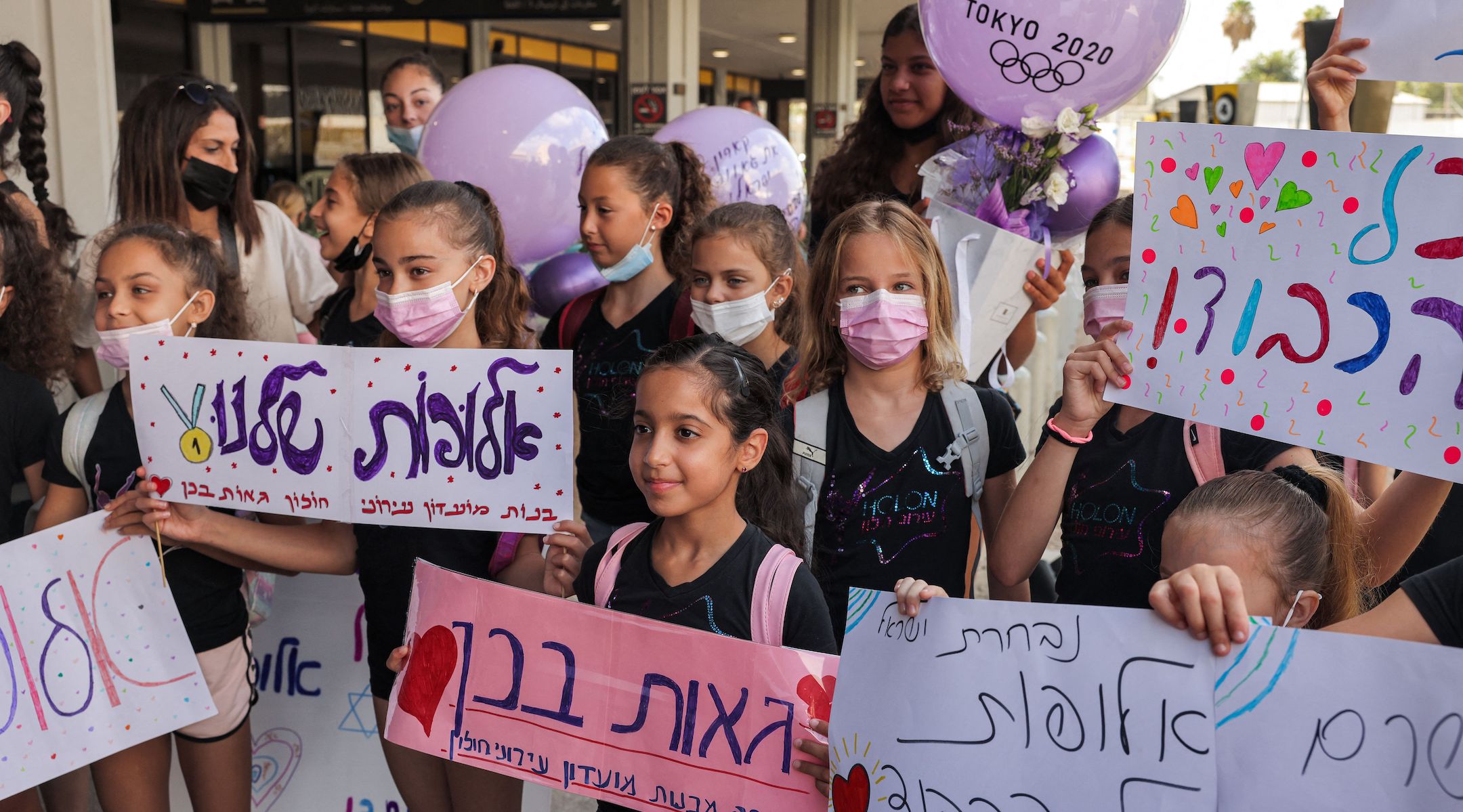 Young fans wait for Linoy Ashram to arrive at Ben Gurion Airport