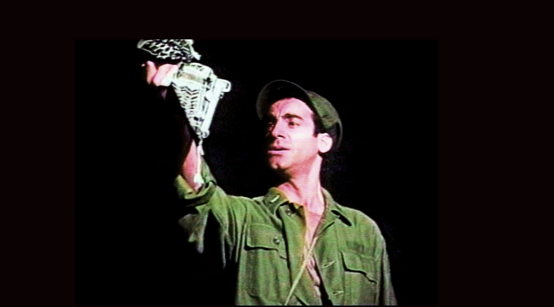 An actor playing a soldier onstage