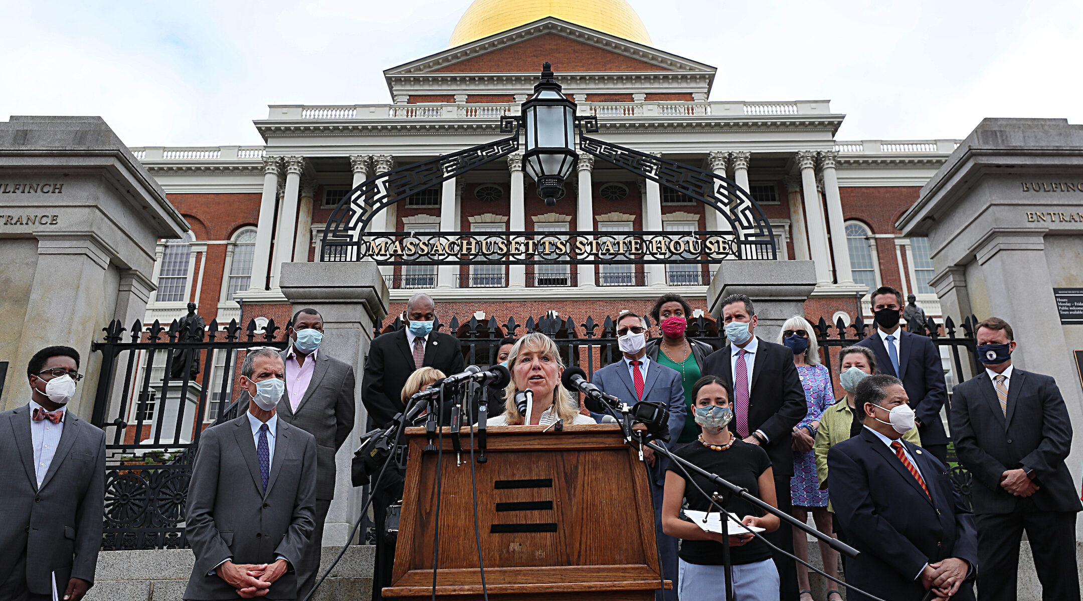 Legislators outside the Massachusetts state Capitol building