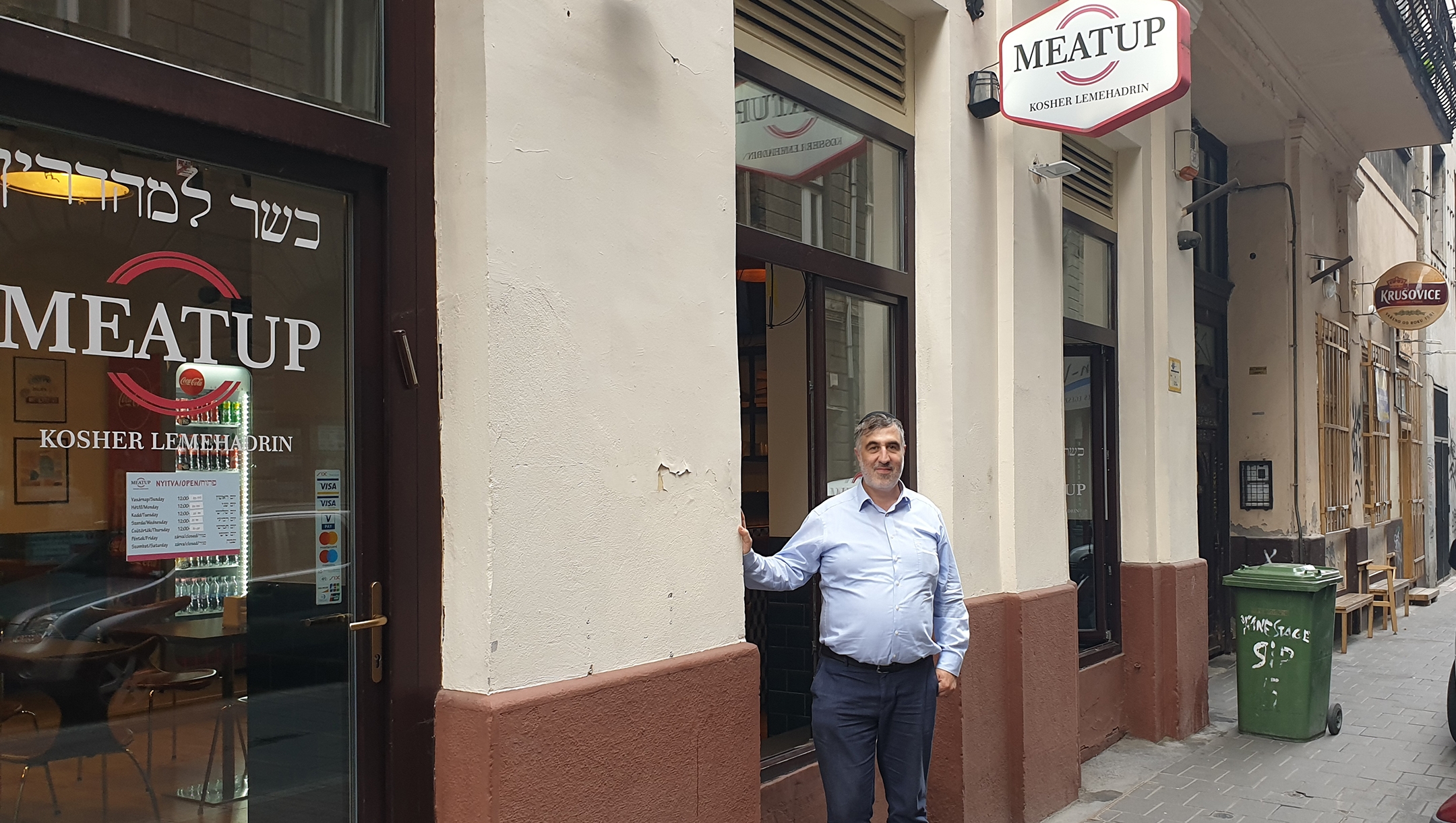 László Györfi invites patrons into his kosher restaurant in Budapest, Hungary on Aug. 29, 2021. (Cnaan Liphshiz)
