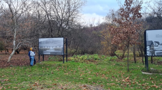 Visitors examine signs at to the former grounds of the Plaszow concentration camp in Krakow