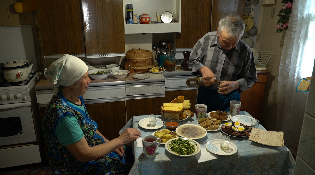 A man and woman in a kitchen