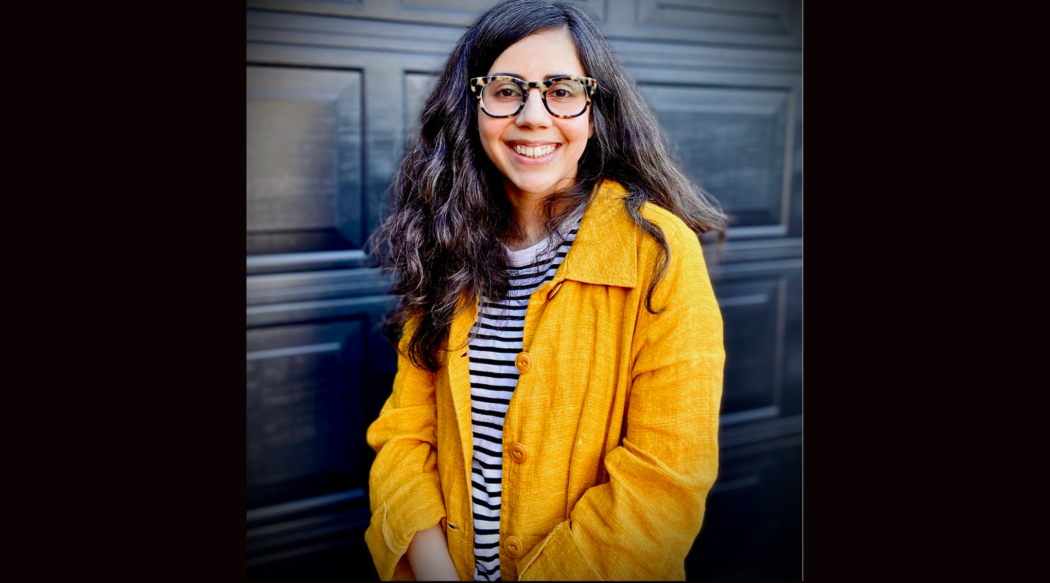 A woman in a yellow coat