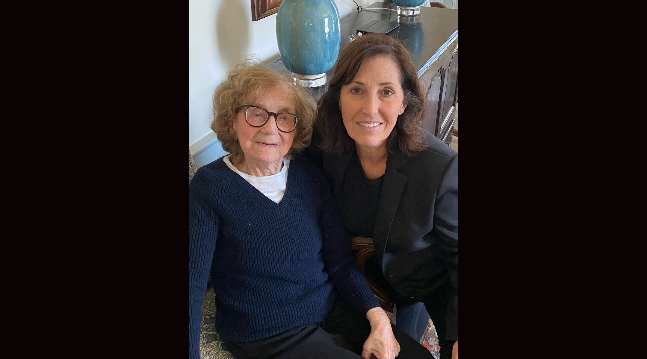 A woman smiling with her mother