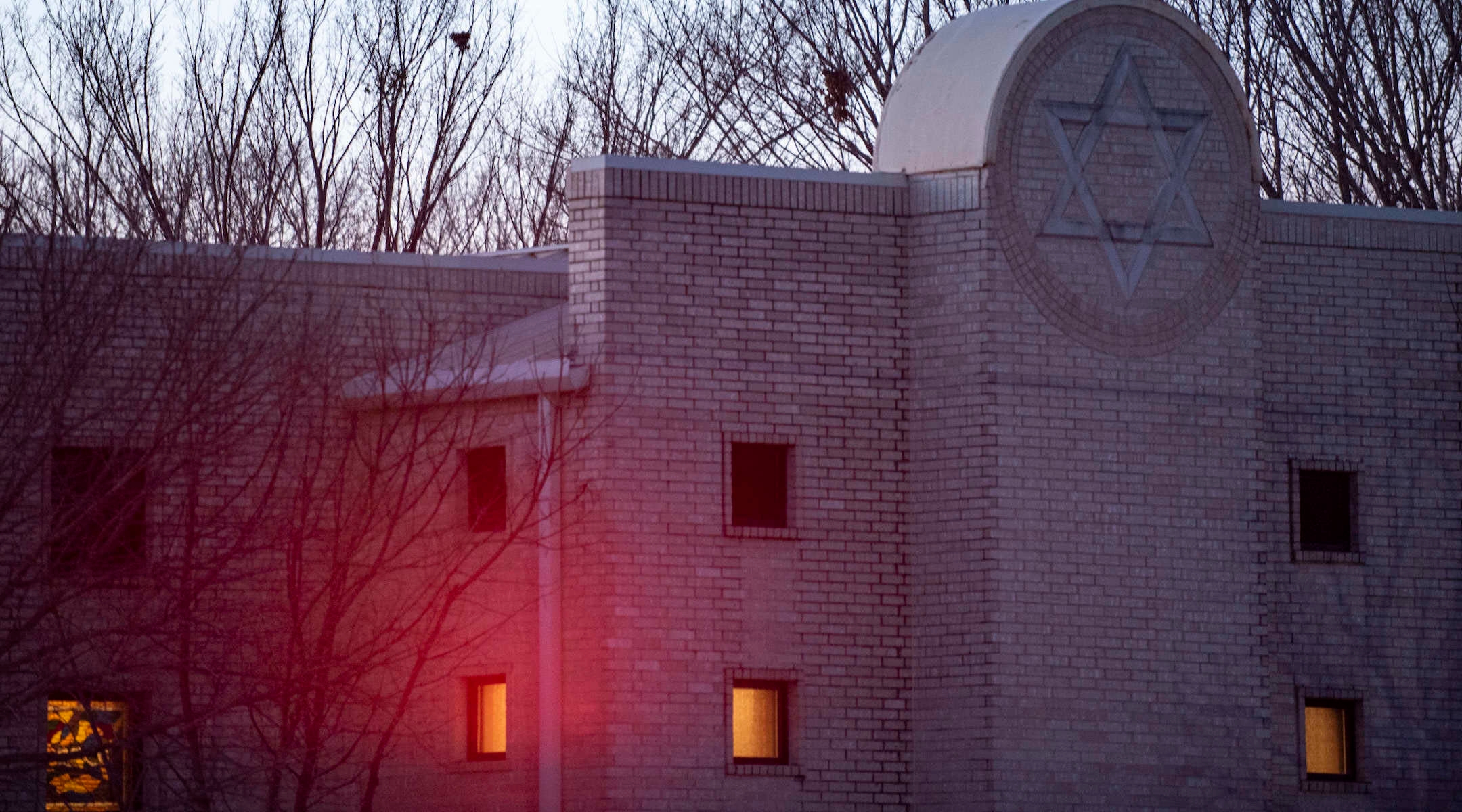 Police lights shine on Congregation Beth Israel synagogue