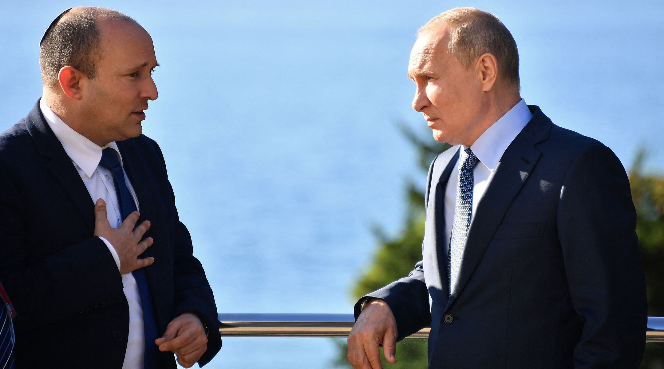 Vladimir Putin and Naftali Bennett.
