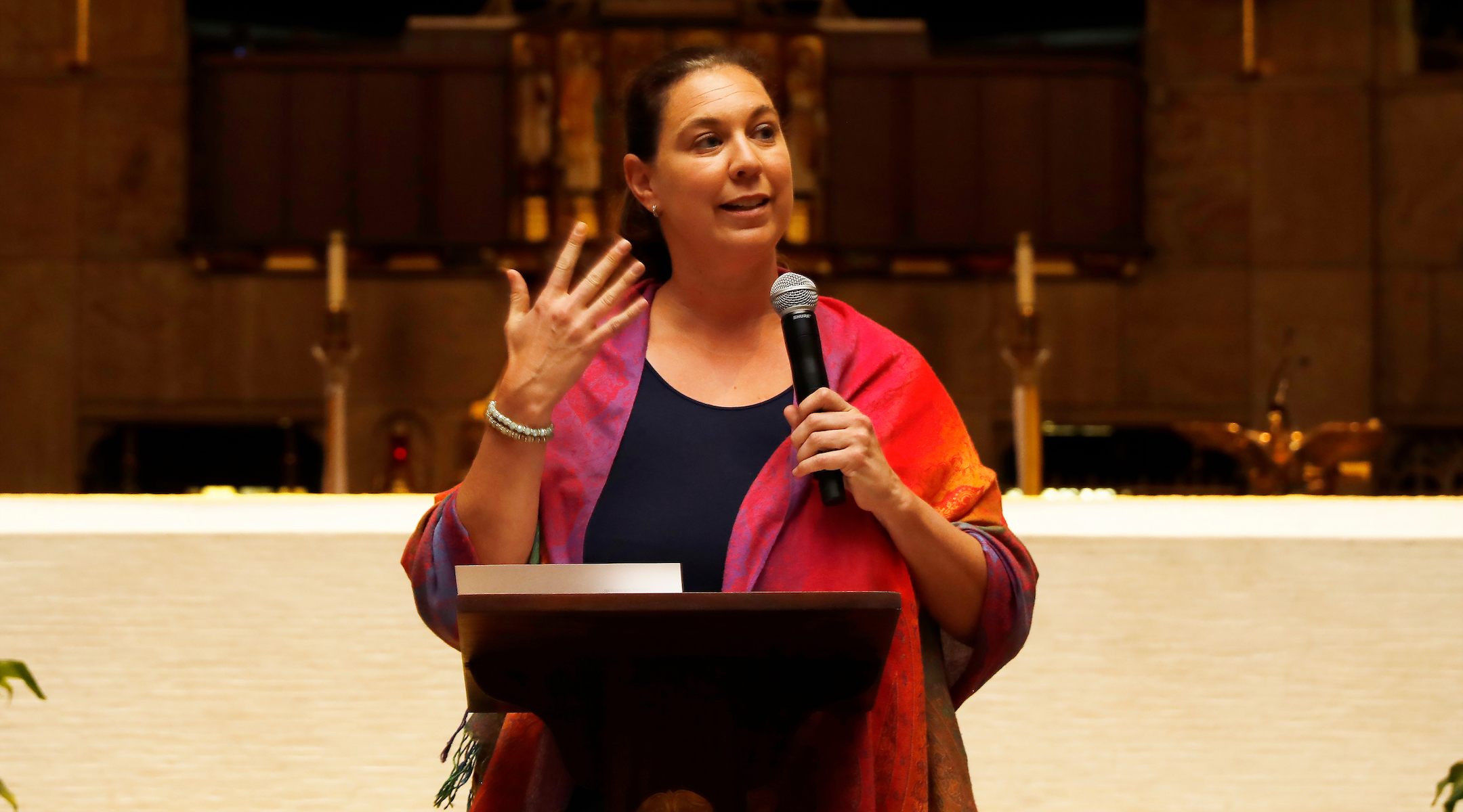 A woman leading a prayer