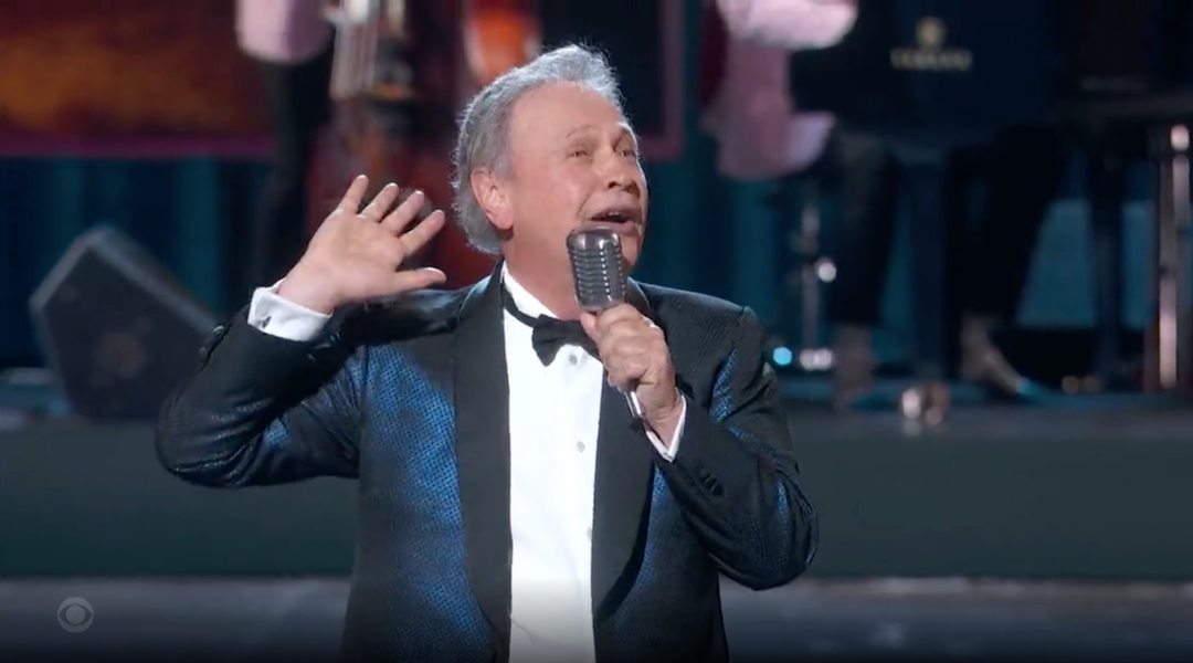 A man in a tuxedo singing