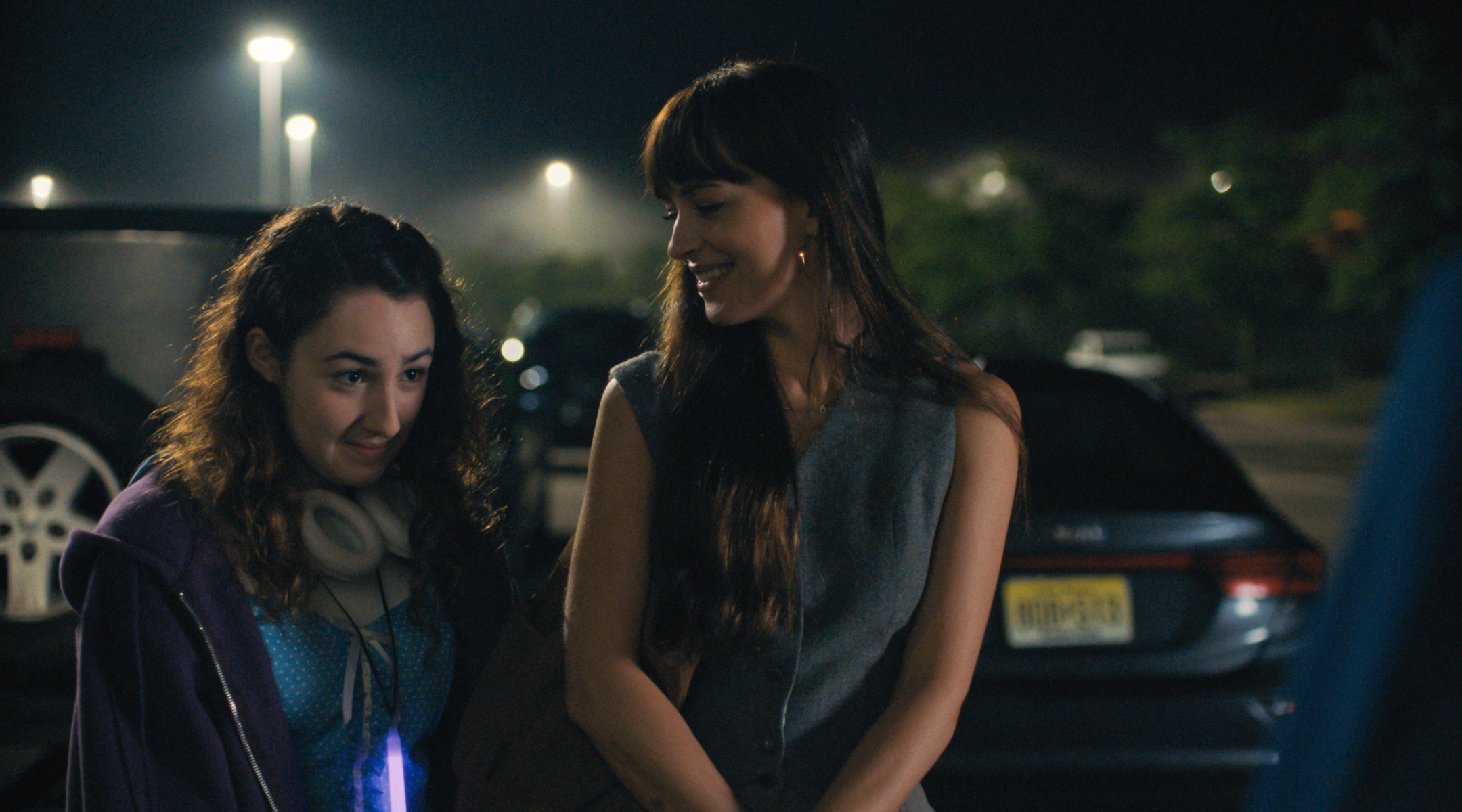 A mother and her daughter standing outside