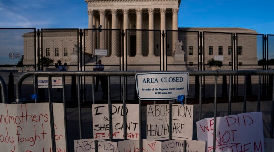 Signs left by abortion-rights supporters.