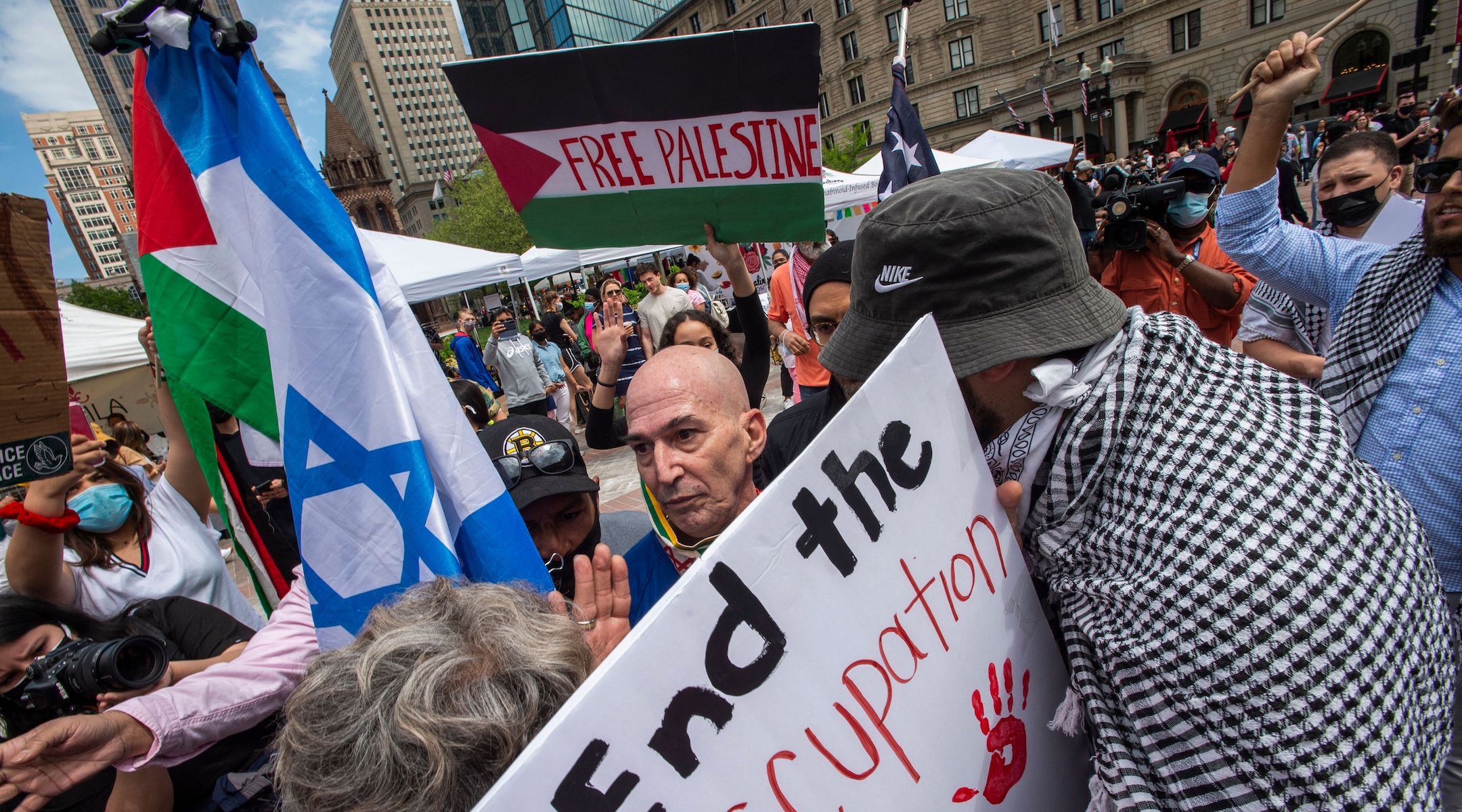 Protesters holding signs