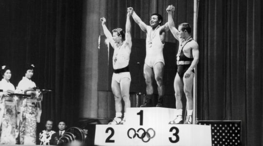 Isaac Berger on the Olympic podium
