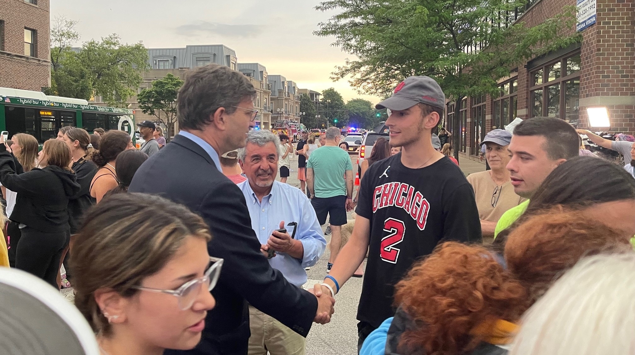 Rep. Brad Schneider, left, chats with a constituent