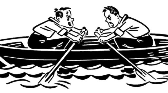 Two People in canoe Paddling in Opposite Directions