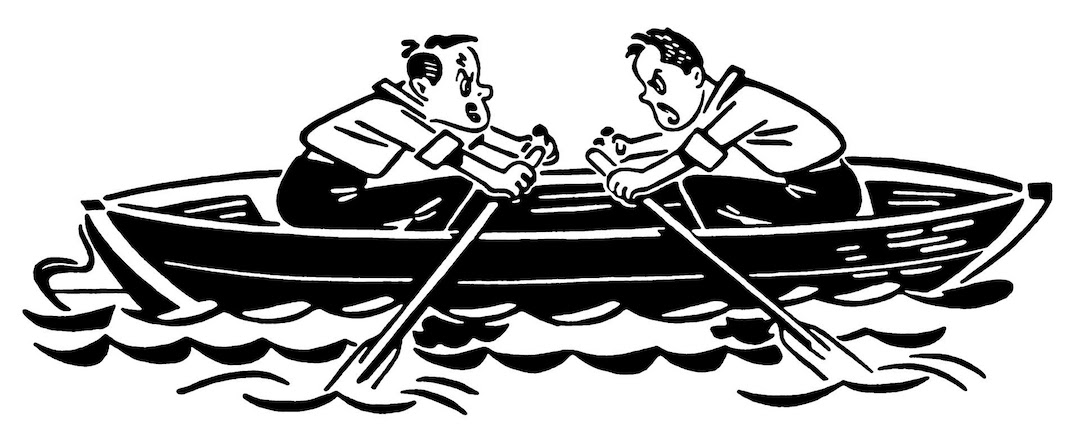 Two People in canoe Paddling in Opposite Directions