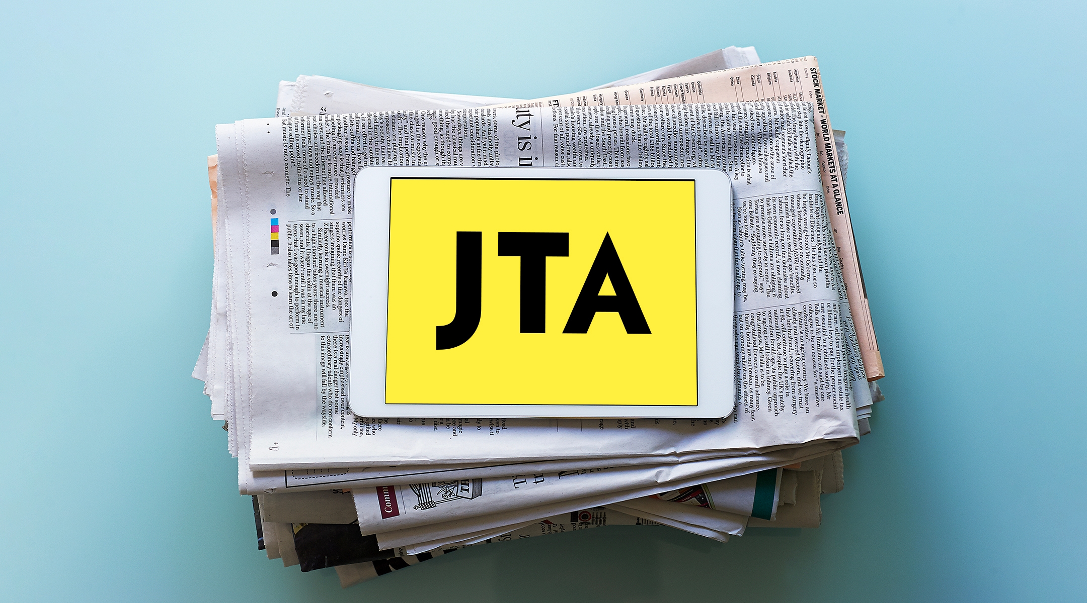 Newspaper with JTA logo.