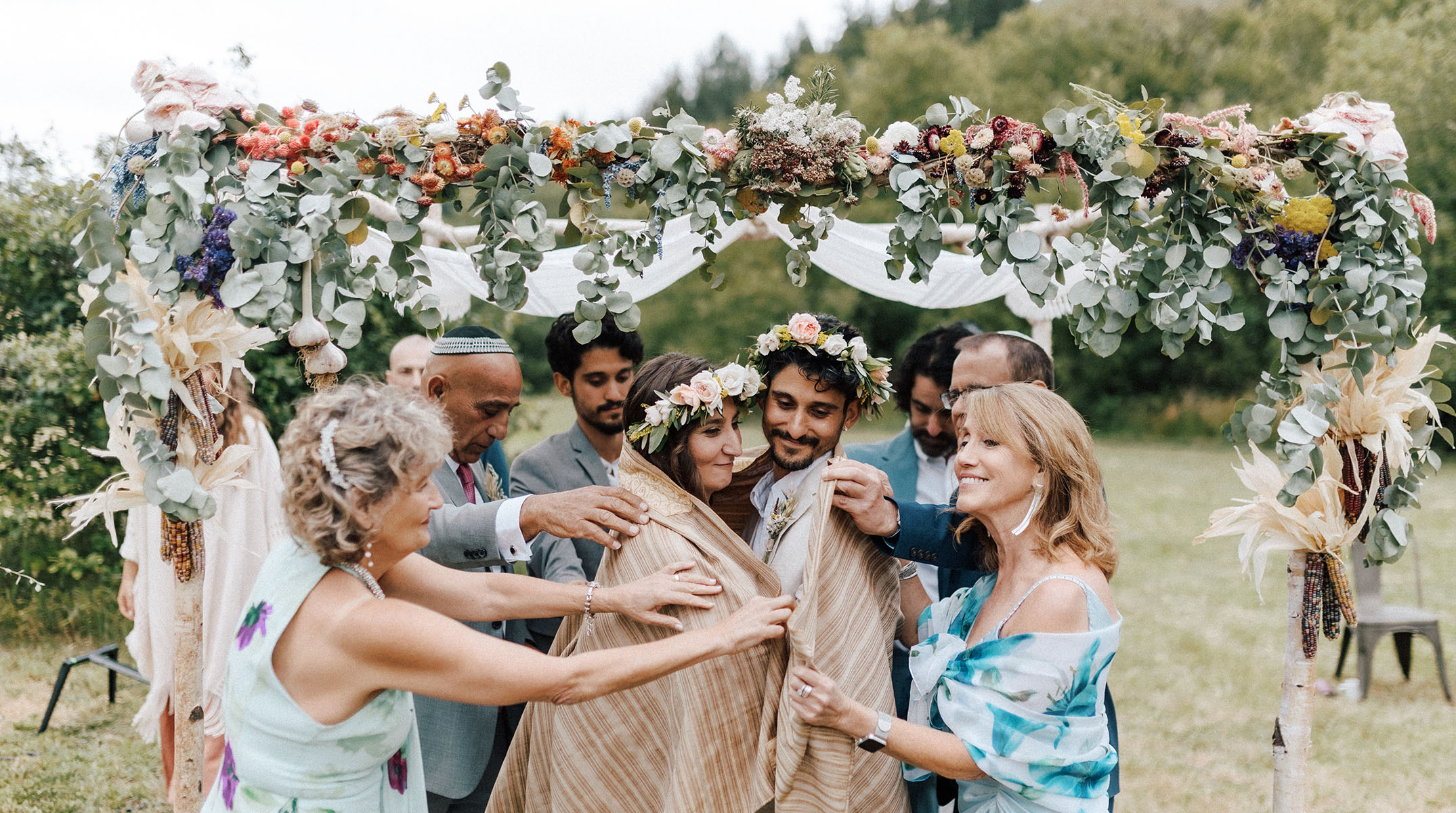 The couple wrapped in a tallit.