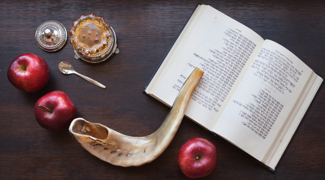A prayer book, shofar, apples and honey
