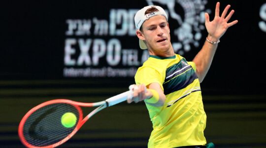 Diego Schwartzman hitting a tennis ball