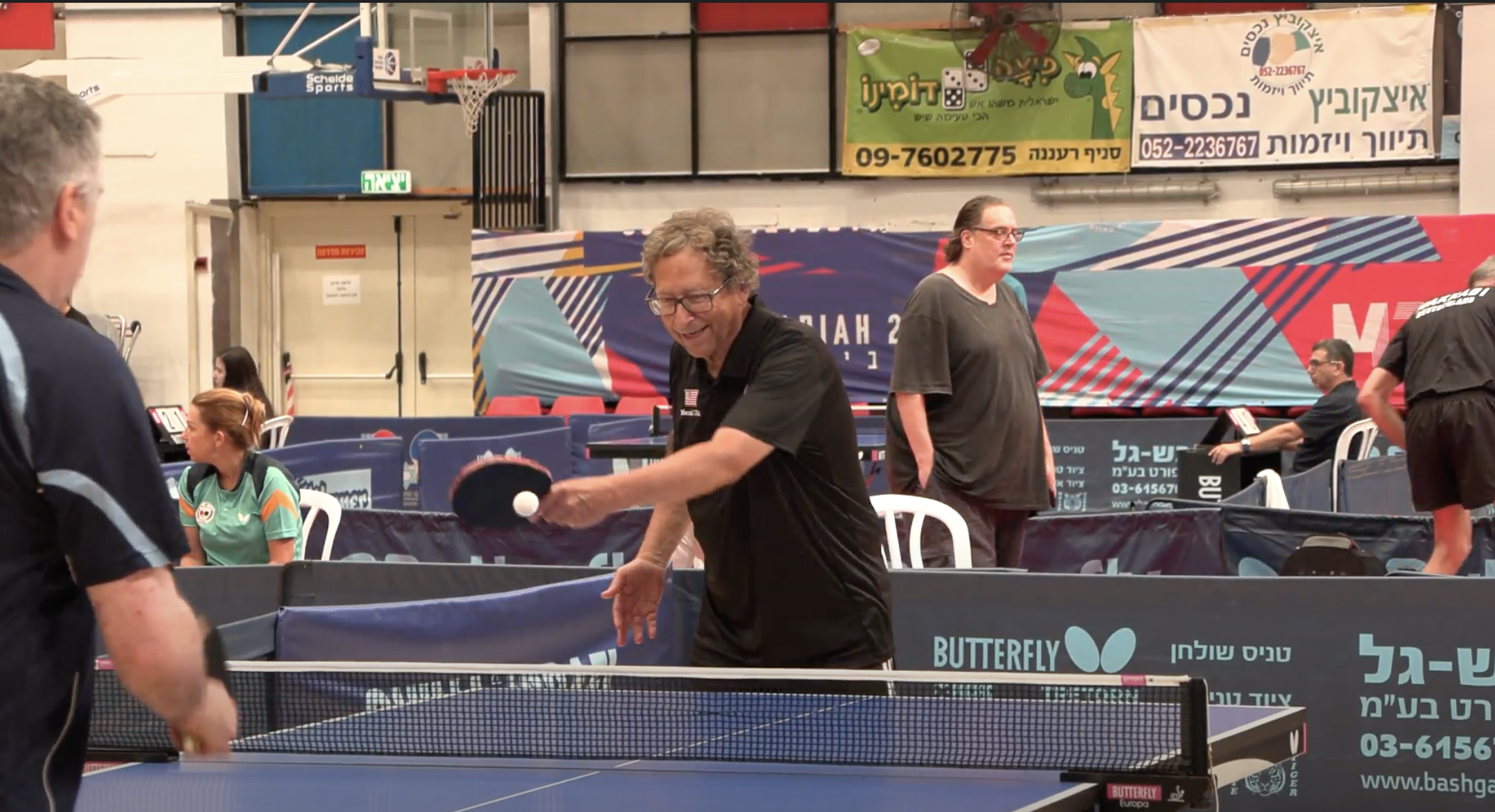 Stuart Weitzman playing ping pong