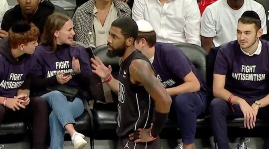 Jewish fans sitting courtside