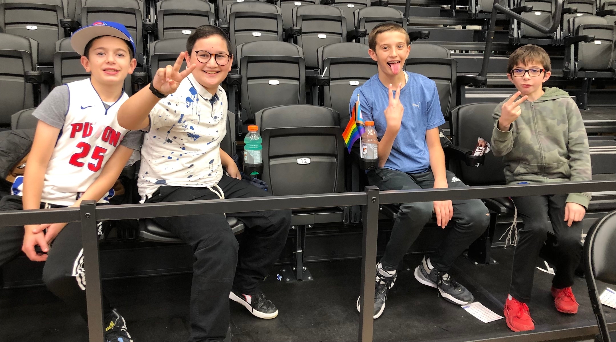 Four boys in a basketball arena