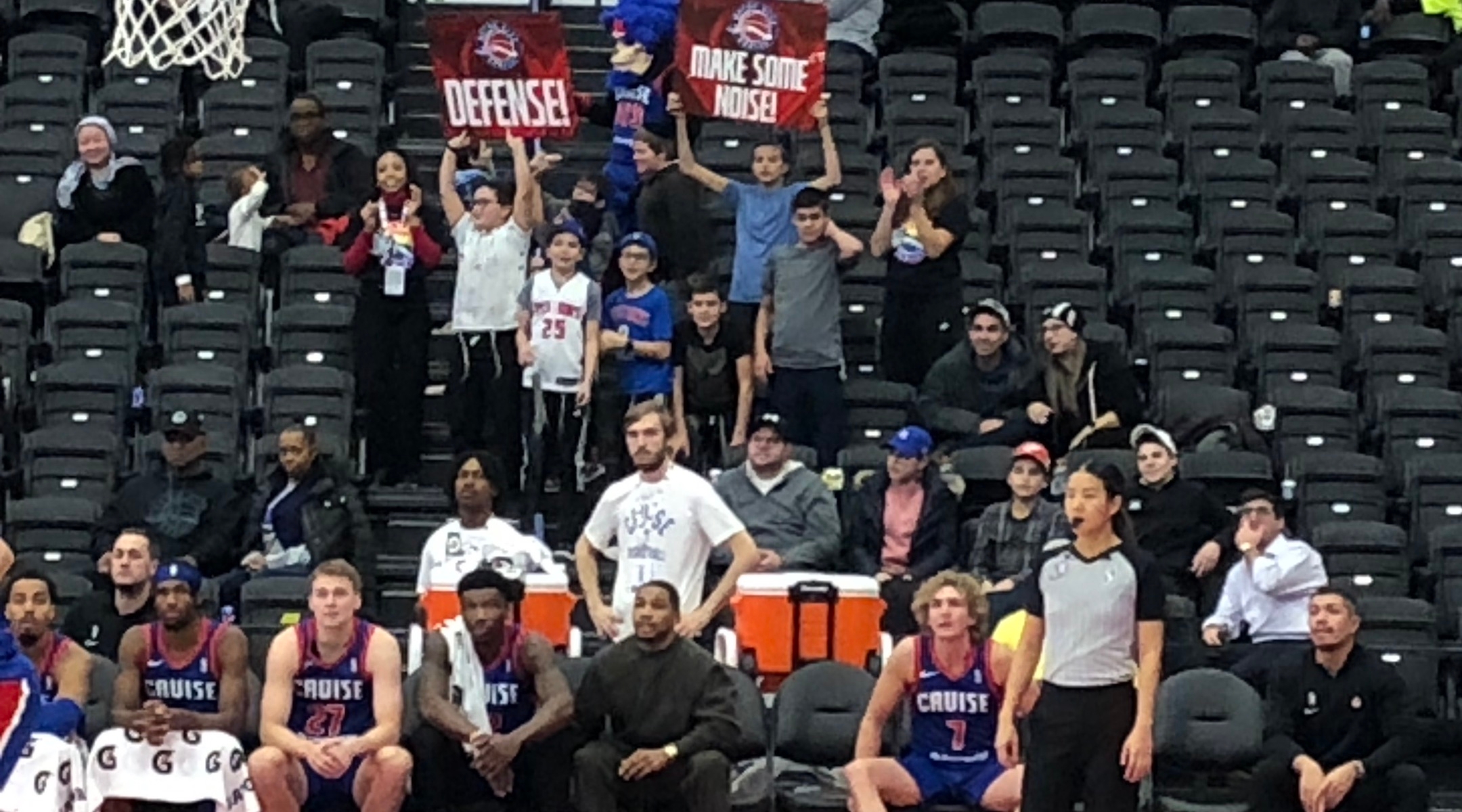 Fans watch a basketball game