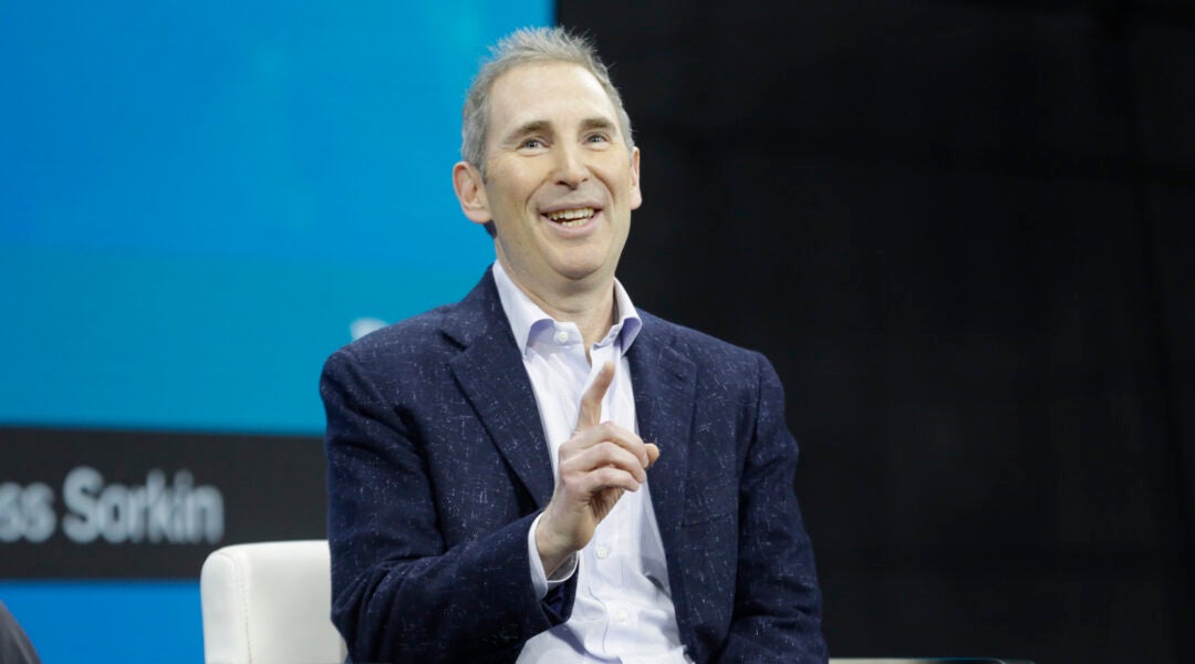 A man onstage at a conference