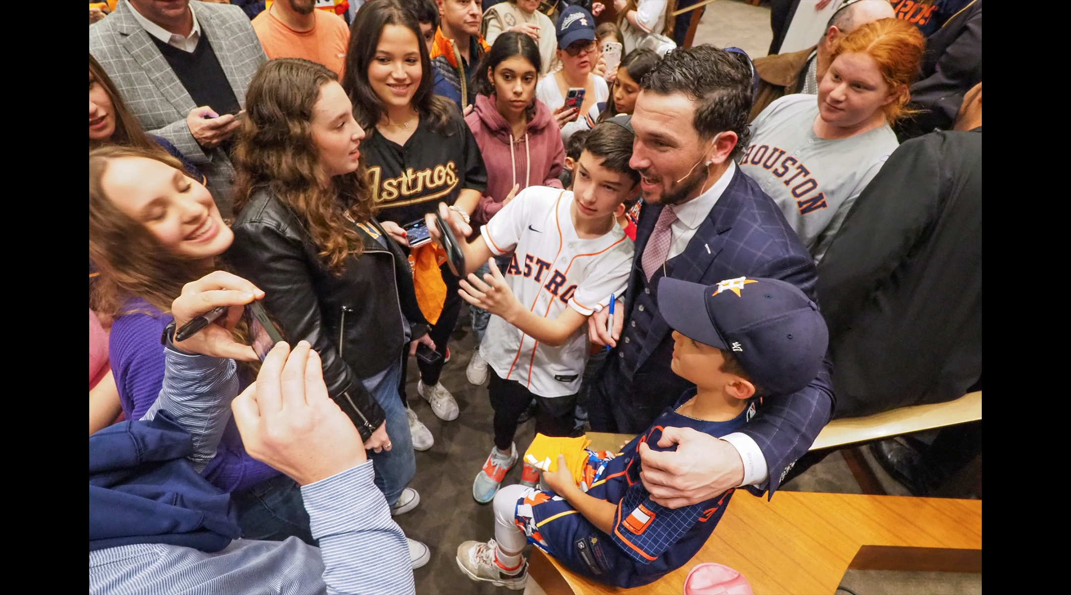 Alex Bregman posing with children