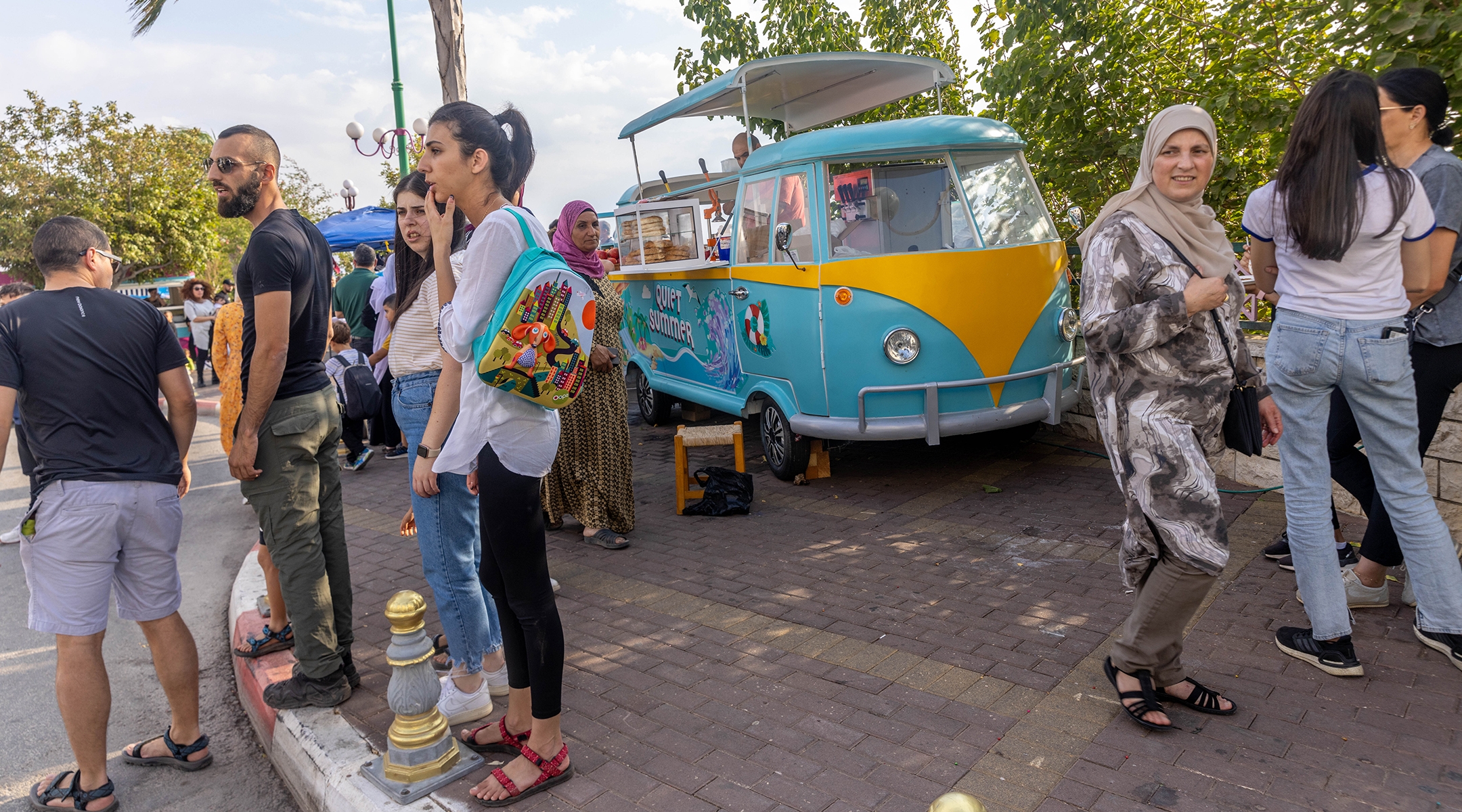 Tourists explore the streets of Ghajar, Oct. 14, 2022. (Yossi Aloni/Flash90)