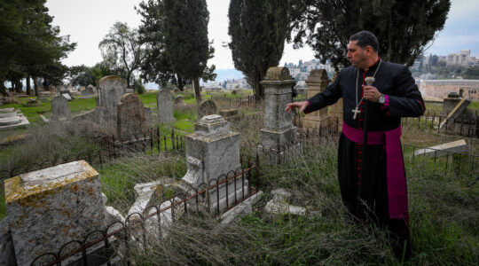 A priest overseeing a Christian cemetery in Jerusalem