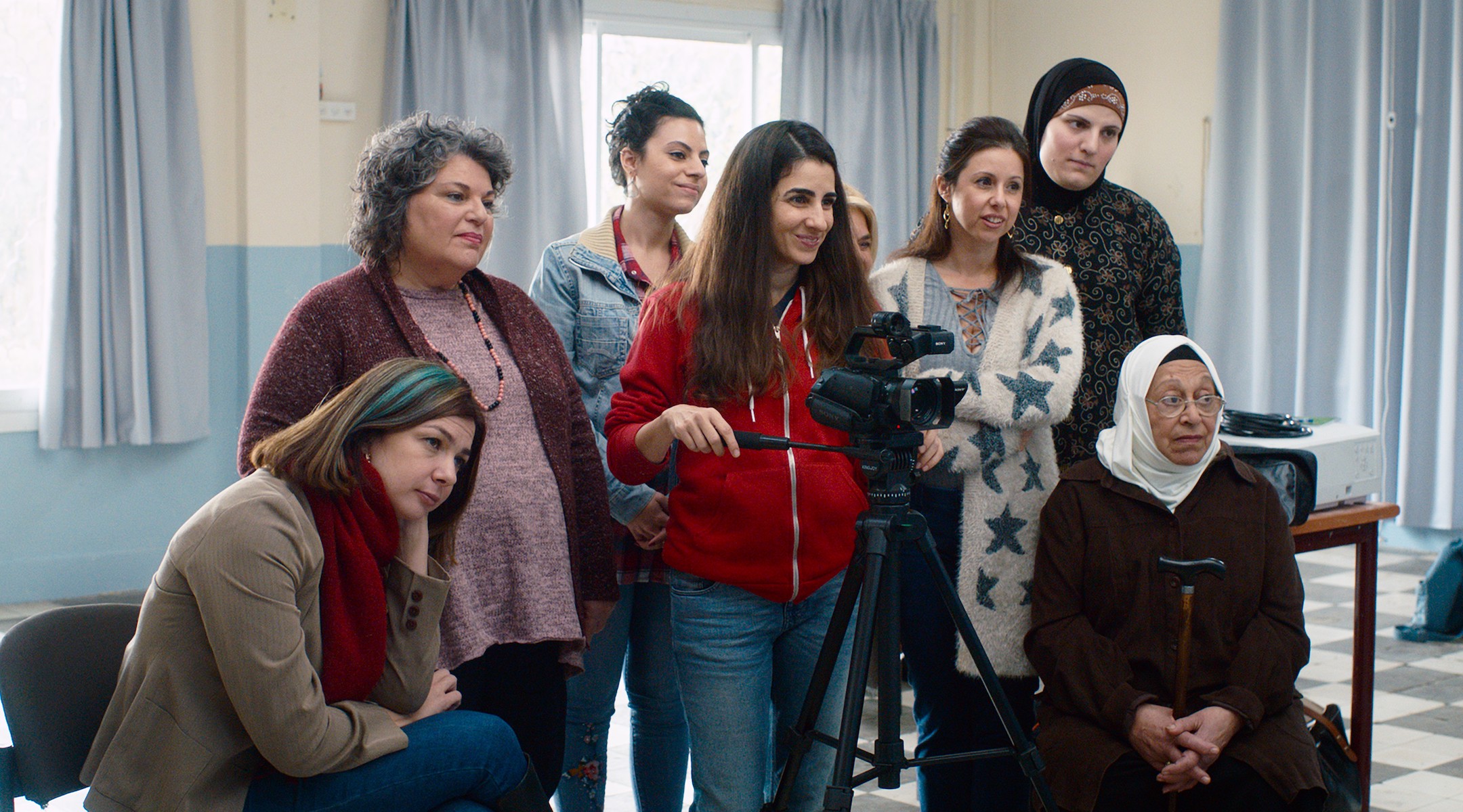 A group of woman in a still from a movie