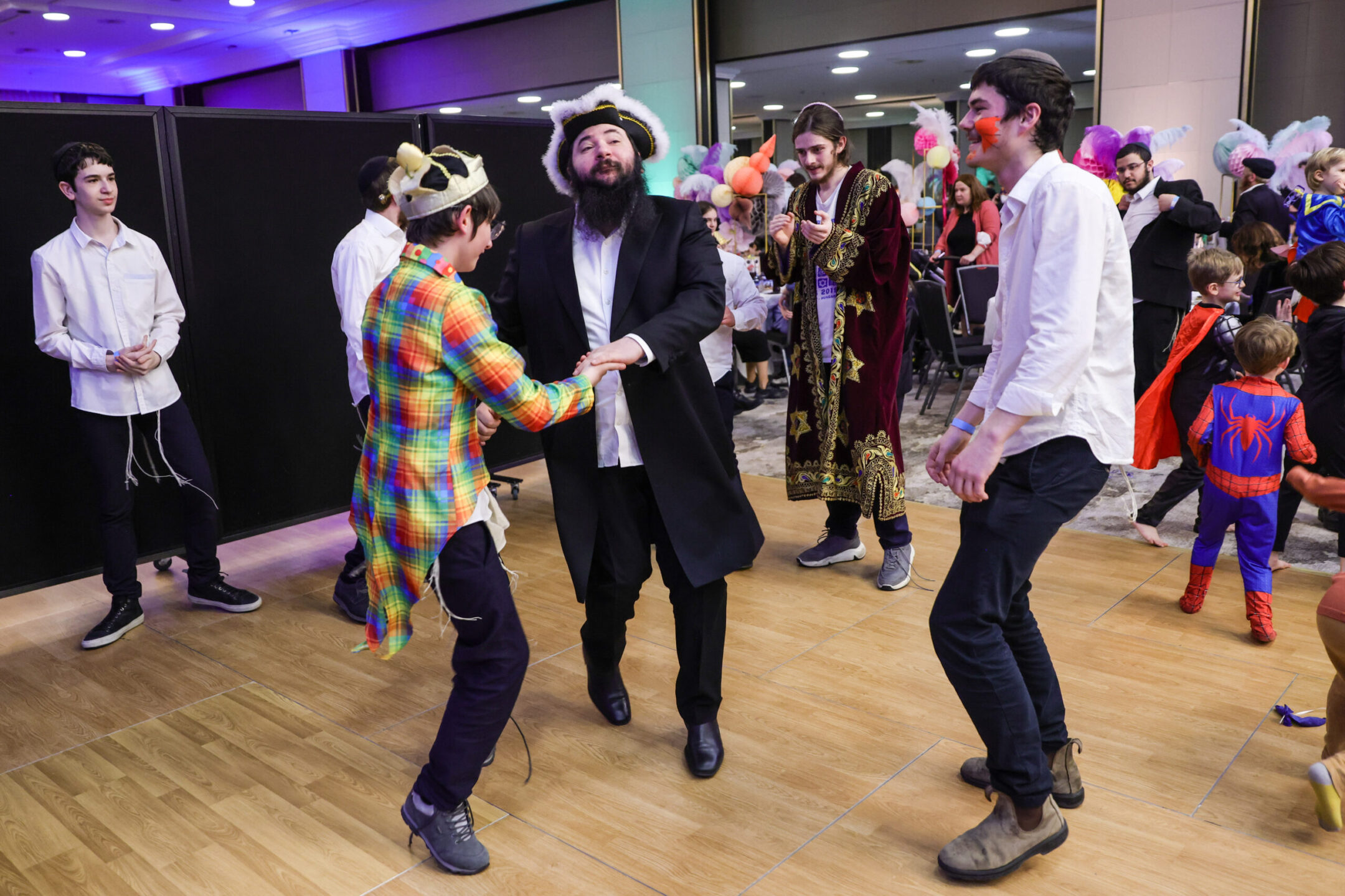Jewish children from Odessa in war-torn Ukraine celebrate Purim 2022 with members of the Chabad Berlin Jewish community, March 17, 2022. (Omer Messinger/Getty Images)