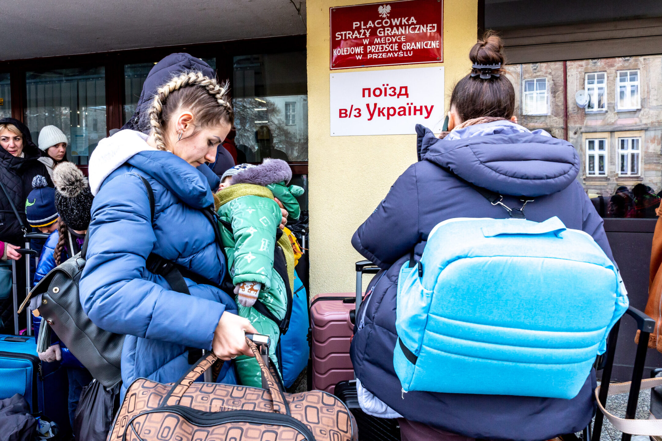 Ukrainians queue at the railway station in Przemysl, Poland, to depart for Ukraine, amid a reversal in migration patterns as the Ukraine war ground on, Dec. 20, 2022. (Dominika Zarzycka/NurPhoto via Getty Images)