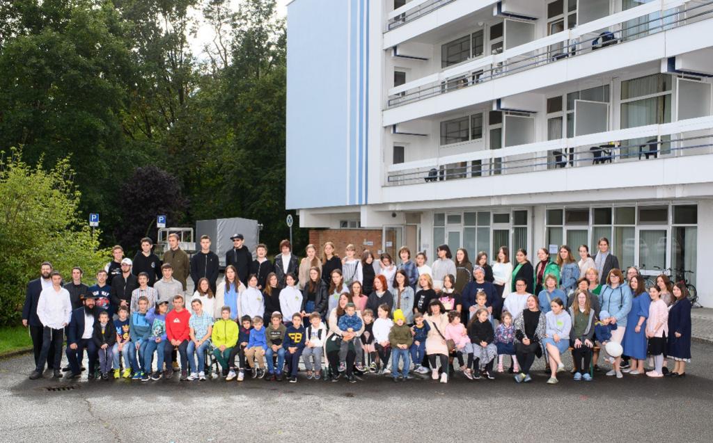 The children and staff of Mishpacha Orphanage in Odessa pose outside the Hotel Mugglesee in Berlin, their home for nearly a year since fleeing war in Ukraine. (Courtesy Chabad Odessa)