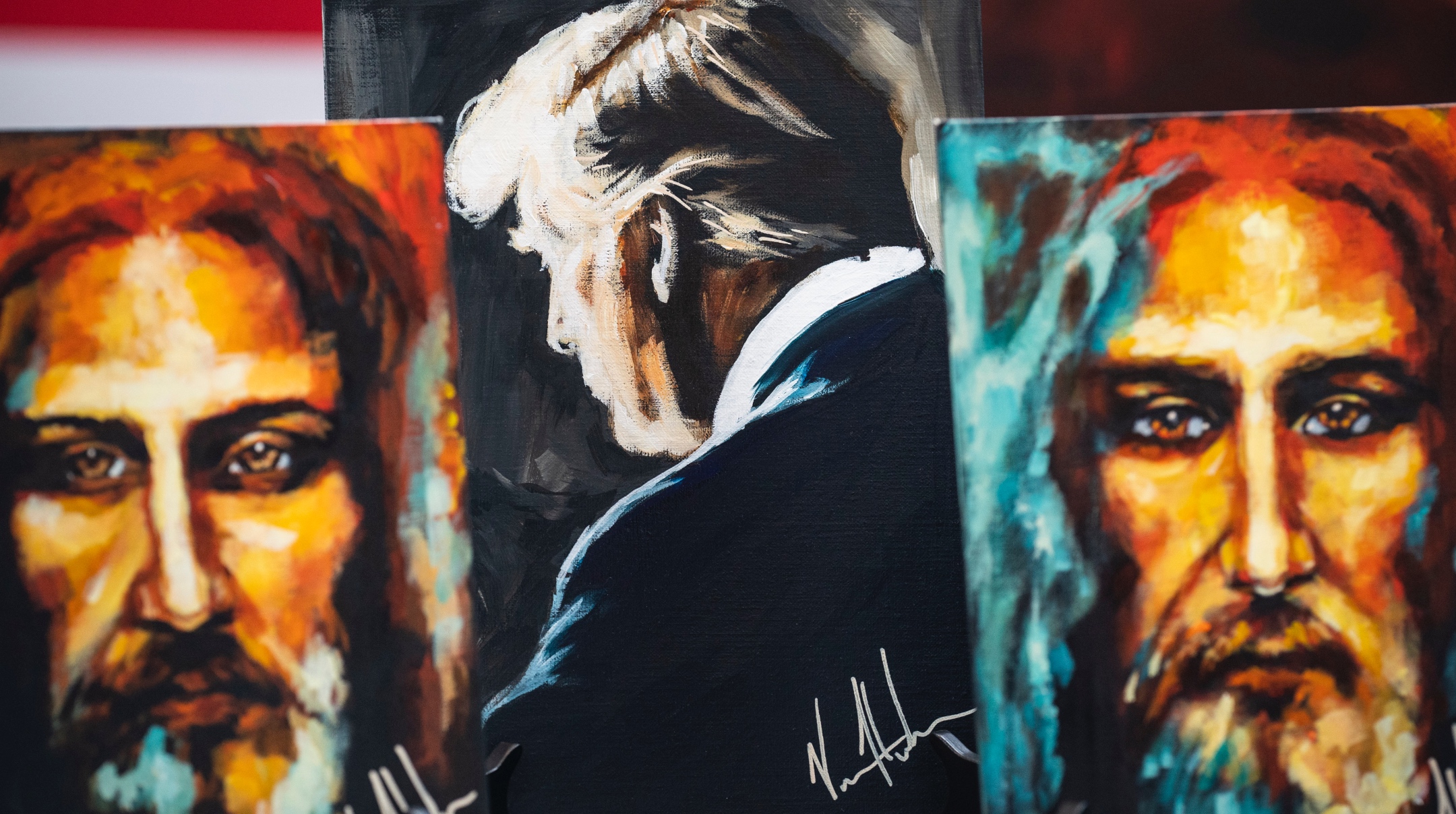 Paintings and prints depicting former President Donald Trump and Jesus are seen for sale on the first day of the Conservative Political Action Conference CPAC held at the Gaylord National Resort & Convention Center in National Harbor, Maryland, March 02, 2023. (Jabin Botsford/The Washington Post via Getty Images)