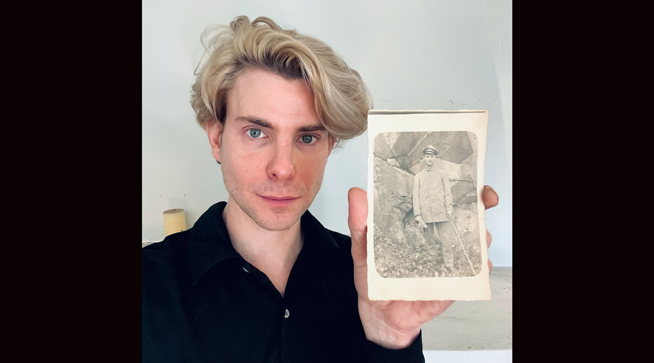 a man holding a photo