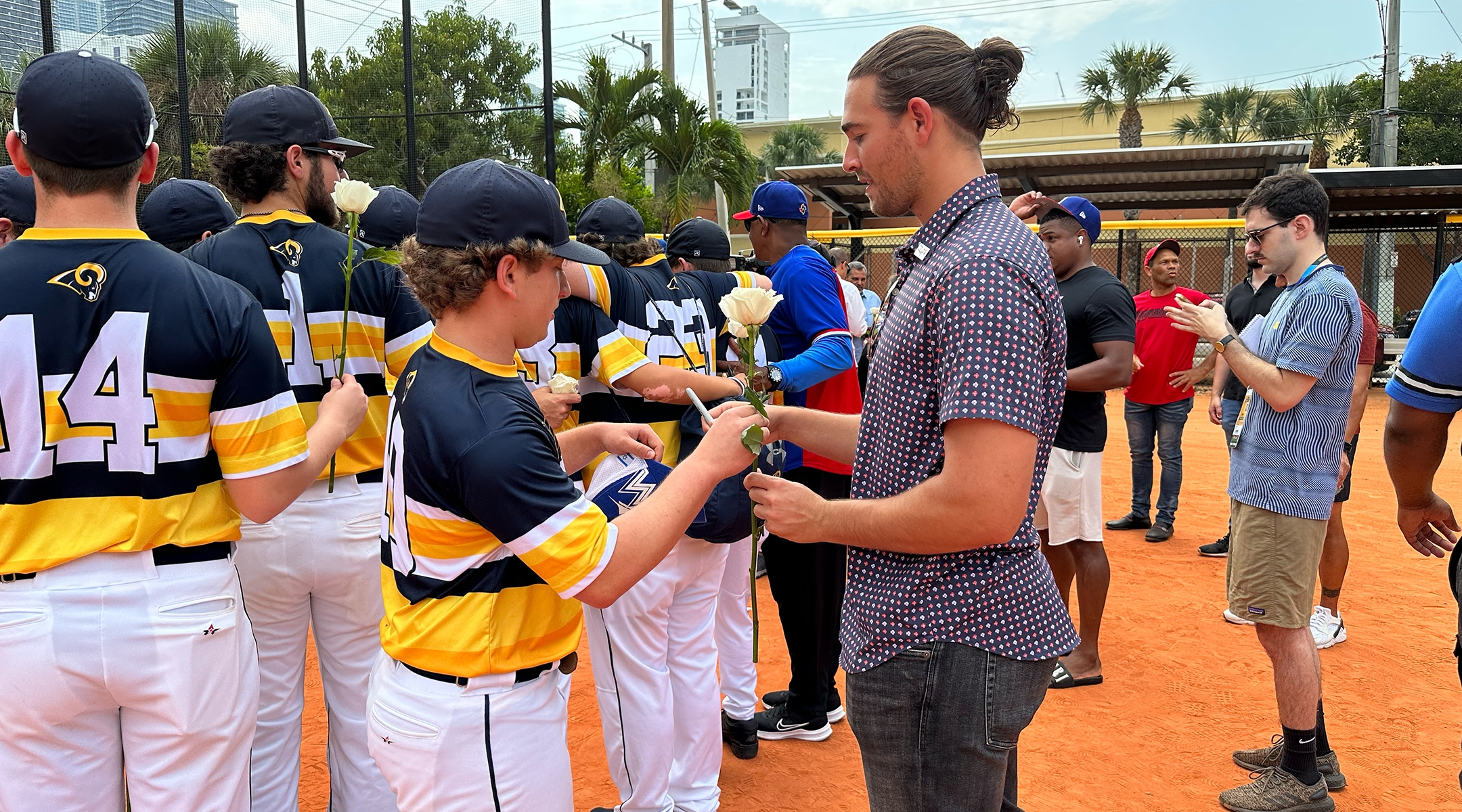 Dean Kremer signing an autograph