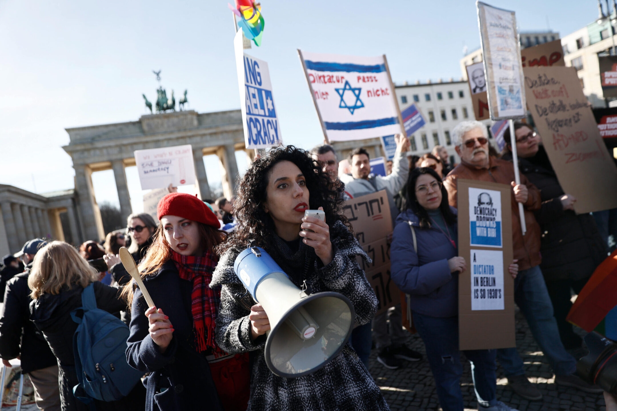 Demonstrators protest against the Israeli government in front of the Brandenburg Gate during Israeli Prime Minister Benjamin Netanyahu’s visit to Berlin, March 16, 2023. (Carsten Koall/picture alliance via Getty Images)