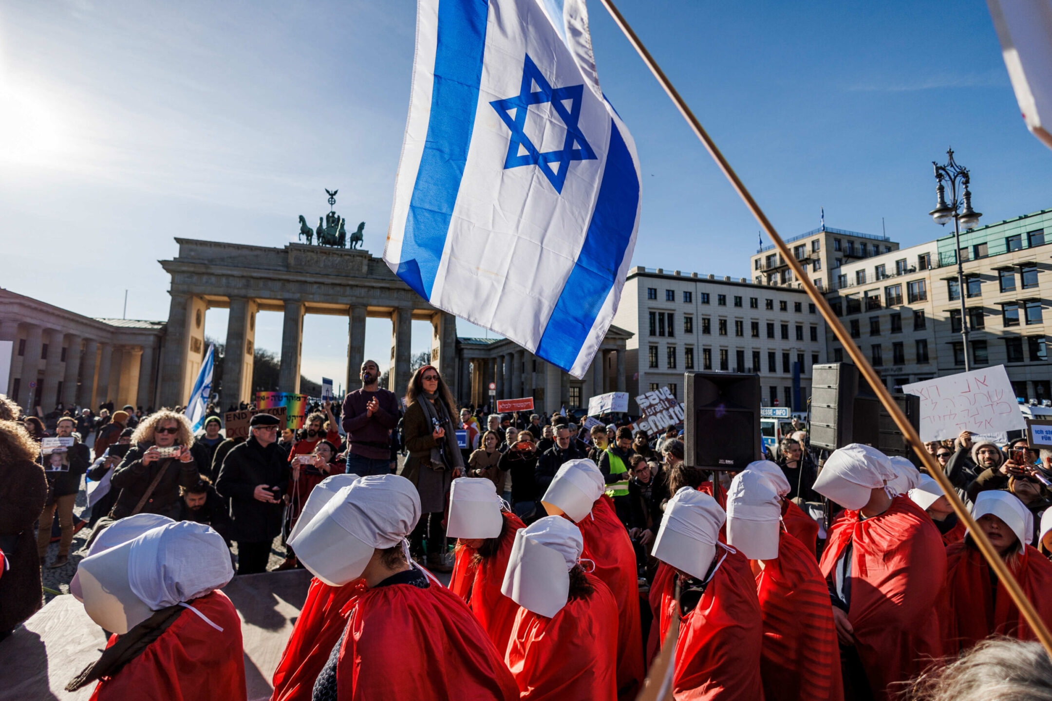 In Berlin, Netanyahu faces tough questions from a key ally, while Israelis abroad protest