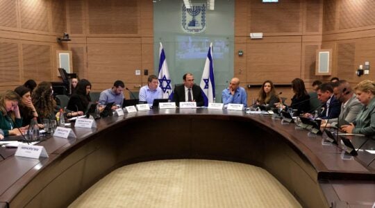 Israeli lawmaker Simcha Rothman, an architect of the judicial overhaul, chairs a session of the Constitution, Law and Justice Committee on March 20, 2023. (Gil Cohen-Magen/AFP via Getty Images)