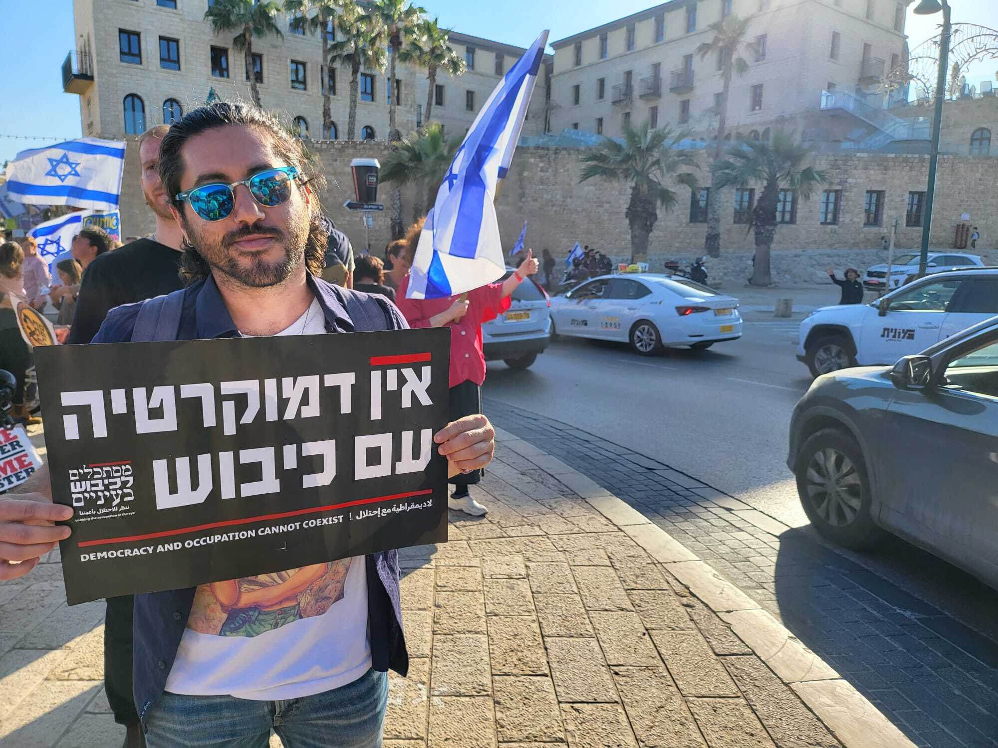 Justin Jacobs, a recent immigrant to Israel from the United States, said he is hopeful about the outcome of the protest movement. (Deborah Danan)