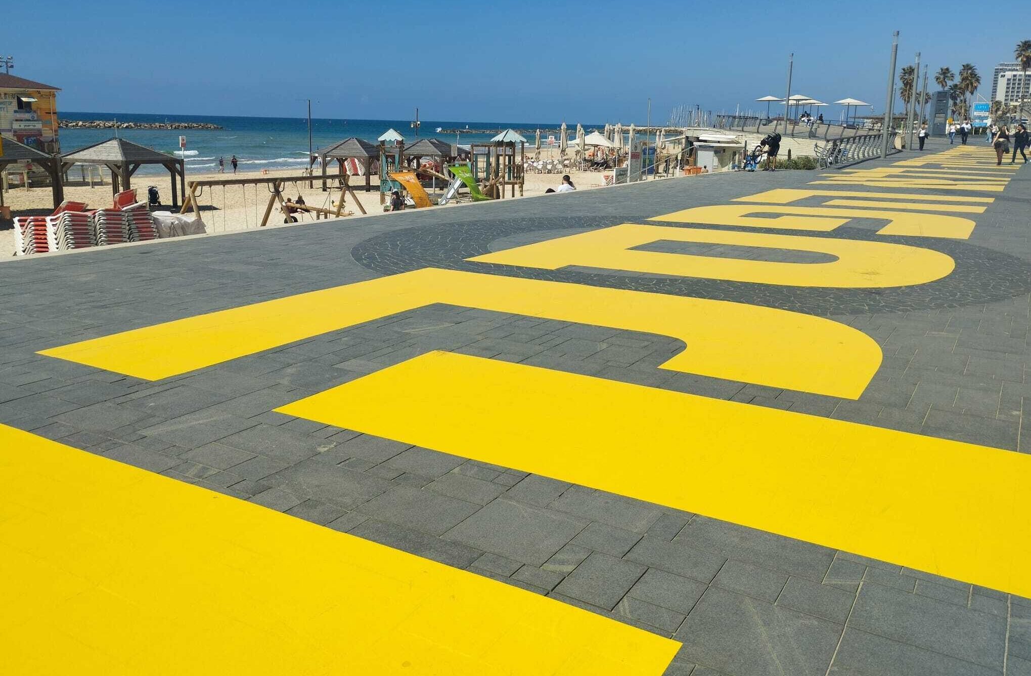 The path along the beach in Tel Aviv has been painted with pro-democracy messages. (Deborah Danan)