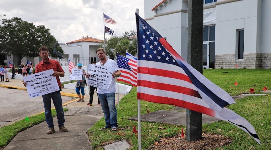 Protesters with joint US-Israel flag