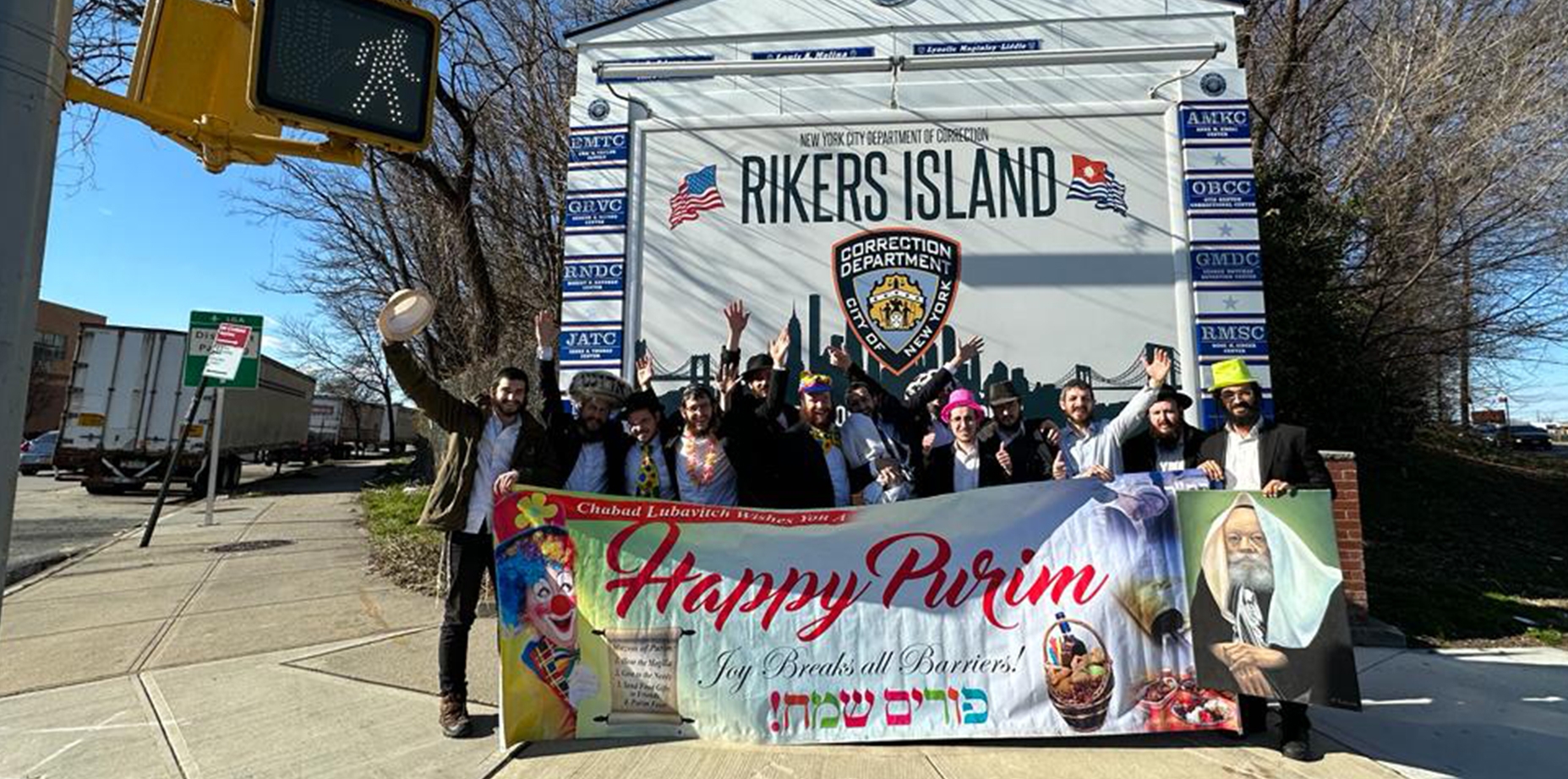 The Lubavitch Youth Organization outside of Rikers Island doing outreach work during Purim. (Courtesy)