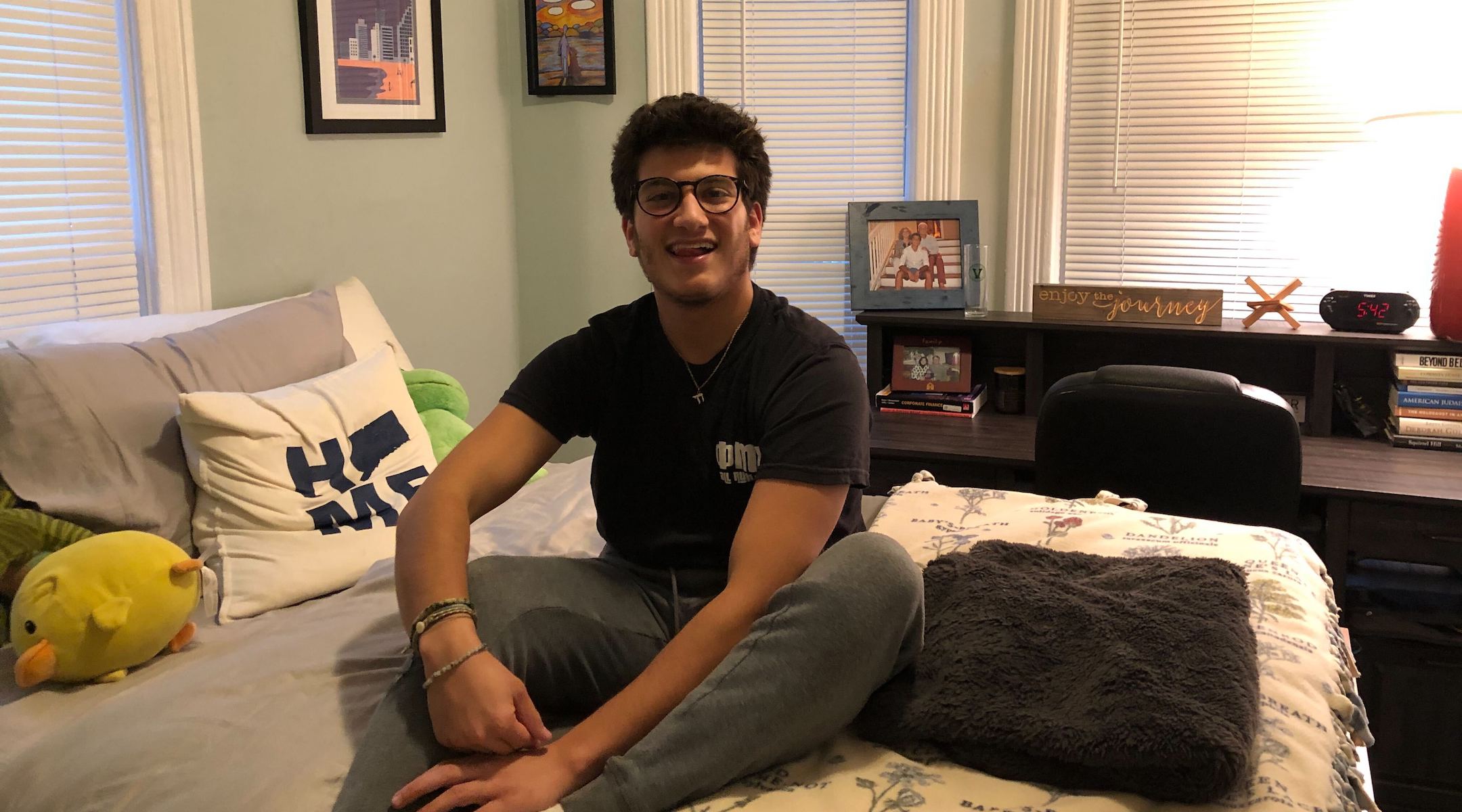 Evan Siegel, a Jewish junior at the University of Vermont, poses in his off-campus housing in Burlington, October 13, 2022. Siegel was initially critical of his school for its handling of a federal antisemitism investigation, but praised its eventual resolution. (Andrew Lapin/Jewish Telegraphic Agency)